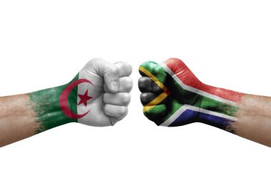 Two hands punch to each others on white background. Country flags painted fists, conflict crisis concept between algeria and south africa