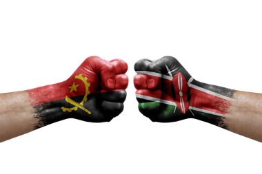 Two hands punch to each others on white background. Country flags painted fists, conflict crisis concept between angola and kenya