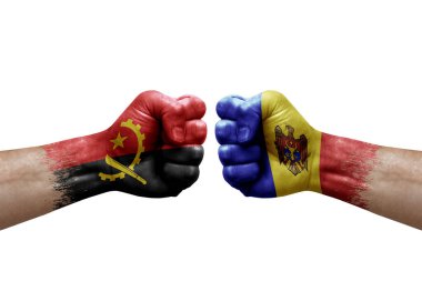 Two hands punch to each others on white background. Country flags painted fists, conflict crisis concept between angola and moldova