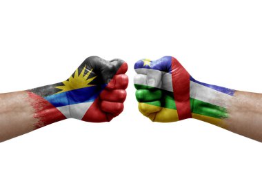 Two hands punch to each others on white background. Country flags painted fists, conflict crisis concept between antigua and barbuda and central african republic