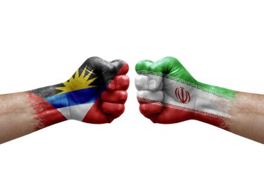 Two hands punch to each others on white background. Country flags painted fists, conflict crisis concept between antigua and barbuda and iran