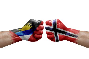 Two hands punch to each others on white background. Country flags painted fists, conflict crisis concept between antigua and barbuda and norway