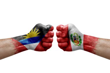 Two hands punch to each others on white background. Country flags painted fists, conflict crisis concept between antigua and barbuda and peru