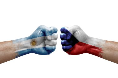 Two hands punch to each others on white background. Country flags painted fists, conflict crisis concept between argentina and czechia