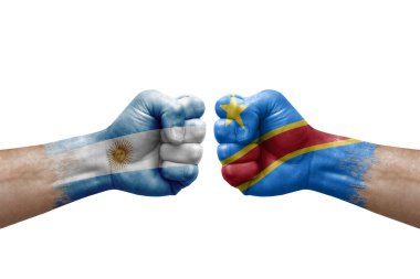 Two hands punch to each others on white background. Country flags painted fists, conflict crisis concept between argentina and dr congo
