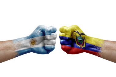 Two hands punch to each others on white background. Country flags painted fists, conflict crisis concept between argentina and ecuador