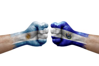 Two hands punch to each others on white background. Country flags painted fists, conflict crisis concept between argentina and el salvador
