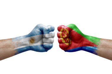 Two hands punch to each others on white background. Country flags painted fists, conflict crisis concept between argentina and eritrea