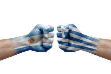Two hands punch to each others on white background. Country flags painted fists, conflict crisis concept between argentina and greece