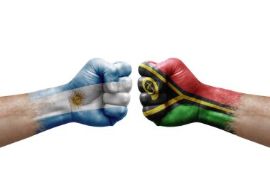 Two hands punch to each others on white background. Country flags painted fists, conflict crisis concept between argentina and vanuatu
