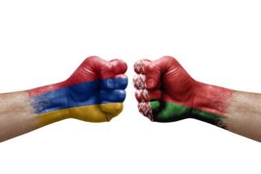 Two hands punch to each others on white background. Country flags painted fists, conflict crisis concept between armenia and belarus