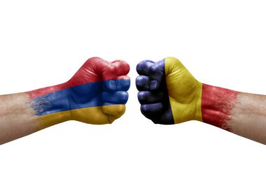 Two hands punch to each others on white background. Country flags painted fists, conflict crisis concept between armenia and chad