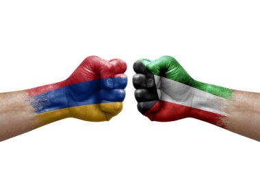 Two hands punch to each others on white background. Country flags painted fists, conflict crisis concept between armenia and kuwait