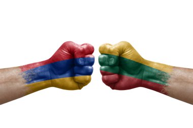 Two hands punch to each others on white background. Country flags painted fists, conflict crisis concept between armenia and lithuania