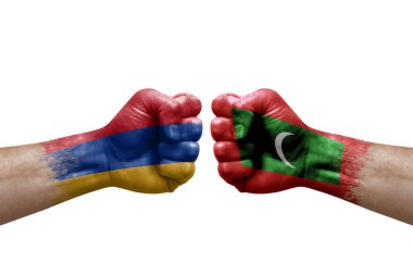 Two hands punch to each others on white background. Country flags painted fists, conflict crisis concept between armenia and maldives