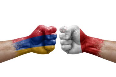 Two hands punch to each others on white background. Country flags painted fists, conflict crisis concept between armenia and malta