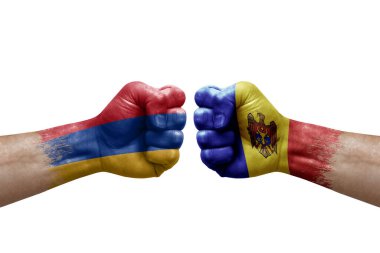 Two hands punch to each others on white background. Country flags painted fists, conflict crisis concept between armenia and moldova