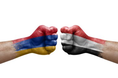 Two hands punch to each others on white background. Country flags painted fists, conflict crisis concept between armenia and yemen