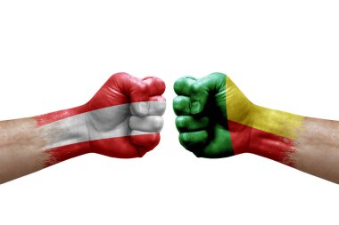 Two hands punch to each others on white background. Country flags painted fists, conflict crisis concept between austria and benin
