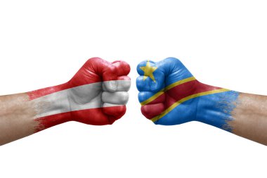 Two hands punch to each others on white background. Country flags painted fists, conflict crisis concept between austria and dr congo