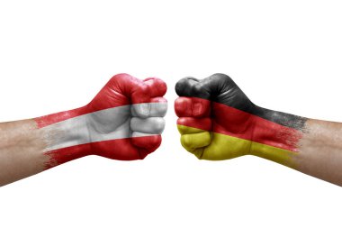 Two hands punch to each others on white background. Country flags painted fists, conflict crisis concept between austria and germany