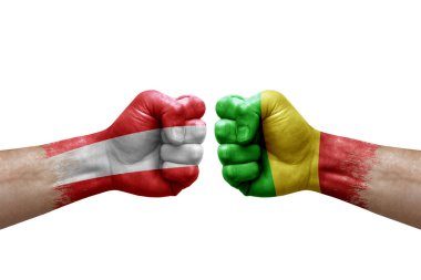 Two hands punch to each others on white background. Country flags painted fists, conflict crisis concept between austria and mali