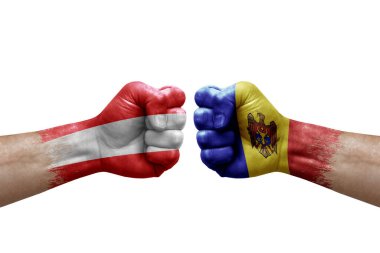 Two hands punch to each others on white background. Country flags painted fists, conflict crisis concept between austria and moldova