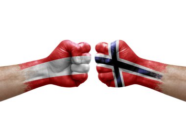 Two hands punch to each others on white background. Country flags painted fists, conflict crisis concept between austria and norway