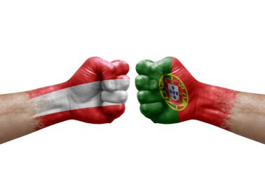 Two hands punch to each others on white background. Country flags painted fists, conflict crisis concept between austria and portugal