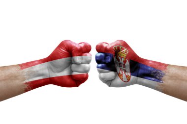 Two hands punch to each others on white background. Country flags painted fists, conflict crisis concept between austria and serbia