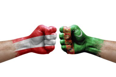 Two hands punch to each others on white background. Country flags painted fists, conflict crisis concept between austria and turkmenistan