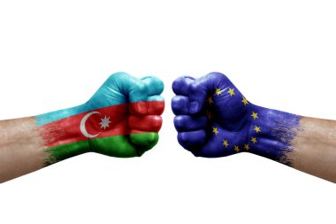 Two hands punch to each others on white background. Country flags painted fists, conflict crisis concept between azerbaijan and european union