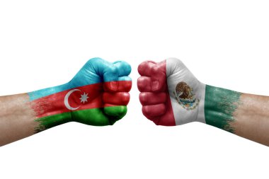 Two hands punch to each others on white background. Country flags painted fists, conflict crisis concept between azerbaijan and mexico
