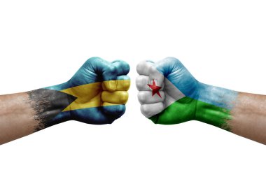 Two hands punch to each others on white background. Country flags painted fists, conflict crisis concept between bahamas and djibouti