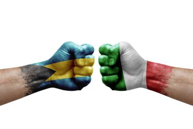 Two hands punch to each others on white background. Country flags painted fists, conflict crisis concept between bahamas and italy