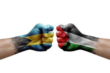 Two hands punch to each others on white background. Country flags painted fists, conflict crisis concept between bahamas and palestine