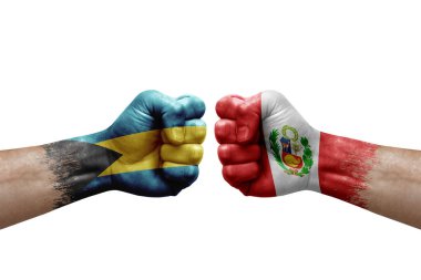 Two hands punch to each others on white background. Country flags painted fists, conflict crisis concept between bahamas and peru