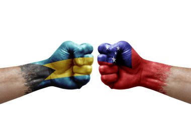 Two hands punch to each others on white background. Country flags painted fists, conflict crisis concept between bahamas and samoa