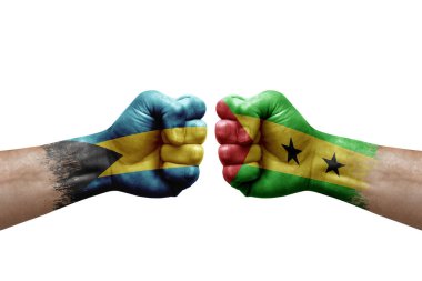 Two hands punch to each others on white background. Country flags painted fists, conflict crisis concept between bahamas and sao tome and principe