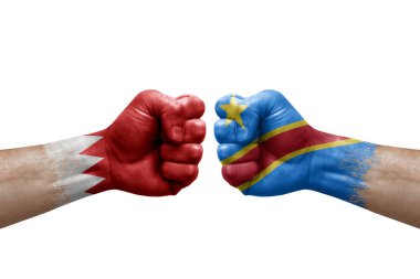 Two hands punch to each others on white background. Country flags painted fists, conflict crisis concept between bahrain and dr congo