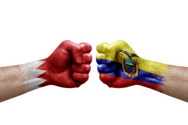 Two hands punch to each others on white background. Country flags painted fists, conflict crisis concept between bahrain and ecuador