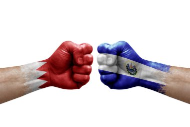 Two hands punch to each others on white background. Country flags painted fists, conflict crisis concept between bahrain and el salvador