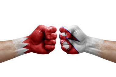 Two hands punch to each others on white background. Country flags painted fists, conflict crisis concept between bahrain and nepal