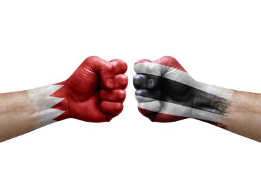 Two hands punch to each others on white background. Country flags painted fists, conflict crisis concept between bahrain and thailand