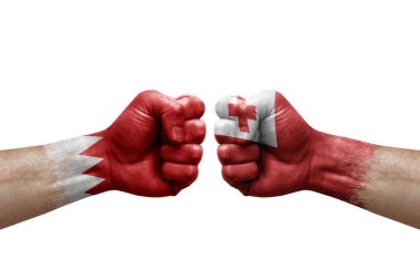 Two hands punch to each others on white background. Country flags painted fists, conflict crisis concept between bahrain and tonga