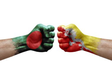 Two hands punch to each others on white background. Country flags painted fists, conflict crisis concept between bangladesh and bhutan