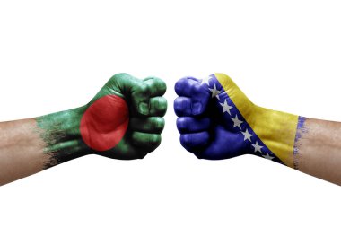 Two hands punch to each others on white background. Country flags painted fists, conflict crisis concept between bangladesh and bosnia