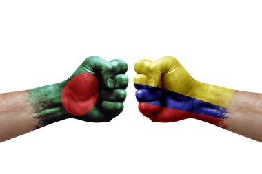 Two hands punch to each others on white background. Country flags painted fists, conflict crisis concept between bangladesh and colombia