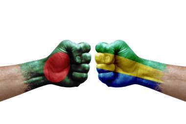 Two hands punch to each others on white background. Country flags painted fists, conflict crisis concept between bangladesh and gabon