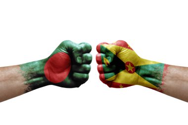 Two hands punch to each others on white background. Country flags painted fists, conflict crisis concept between bangladesh and grenada
